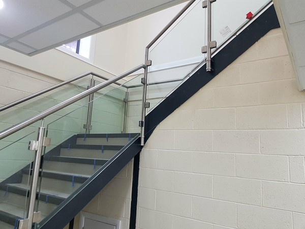 Staircase with stainless steel and glass balustrade